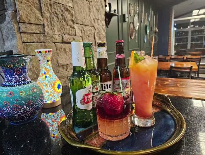Craft cocktails and beer with hand-painted Turkish vase at Emily's bar
