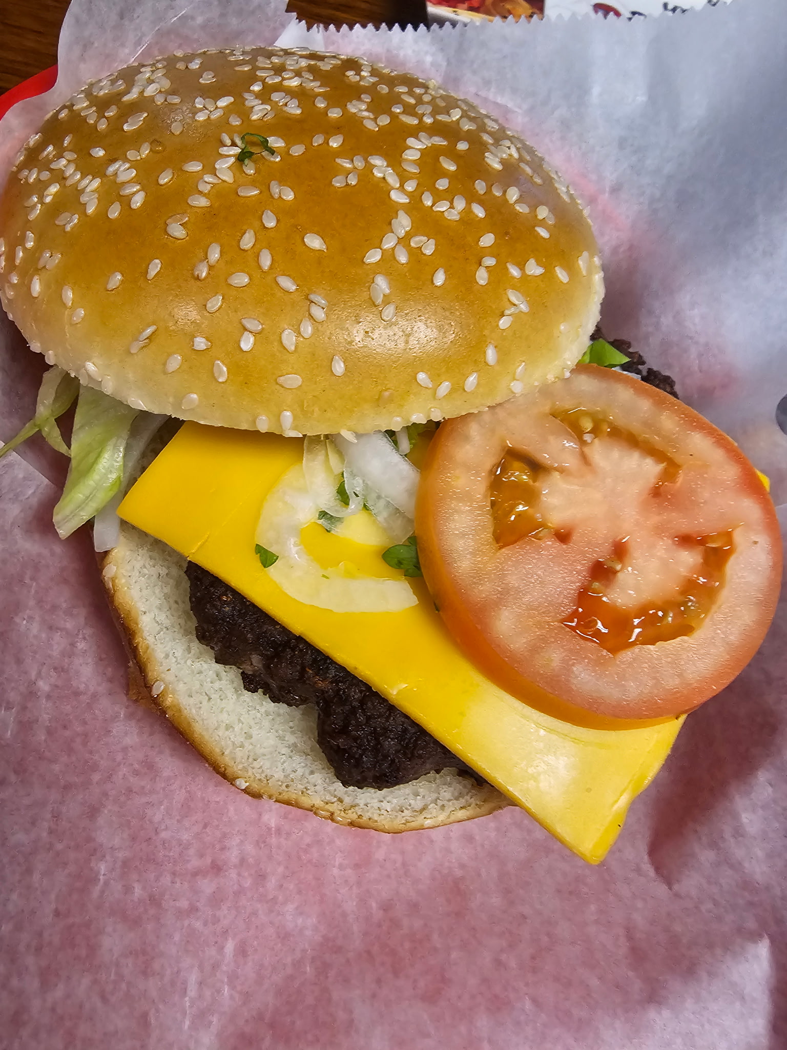 Cheeseburger with American cheese, tomato and lettuce