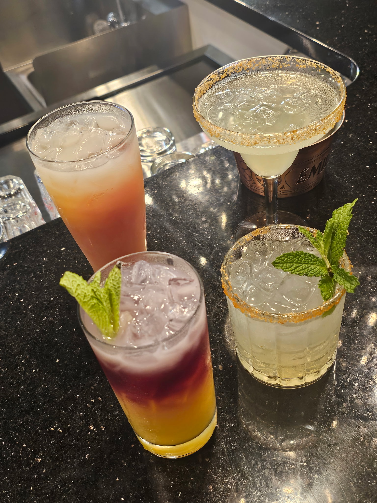 Four handcrafted cocktails including a margarita and mojito