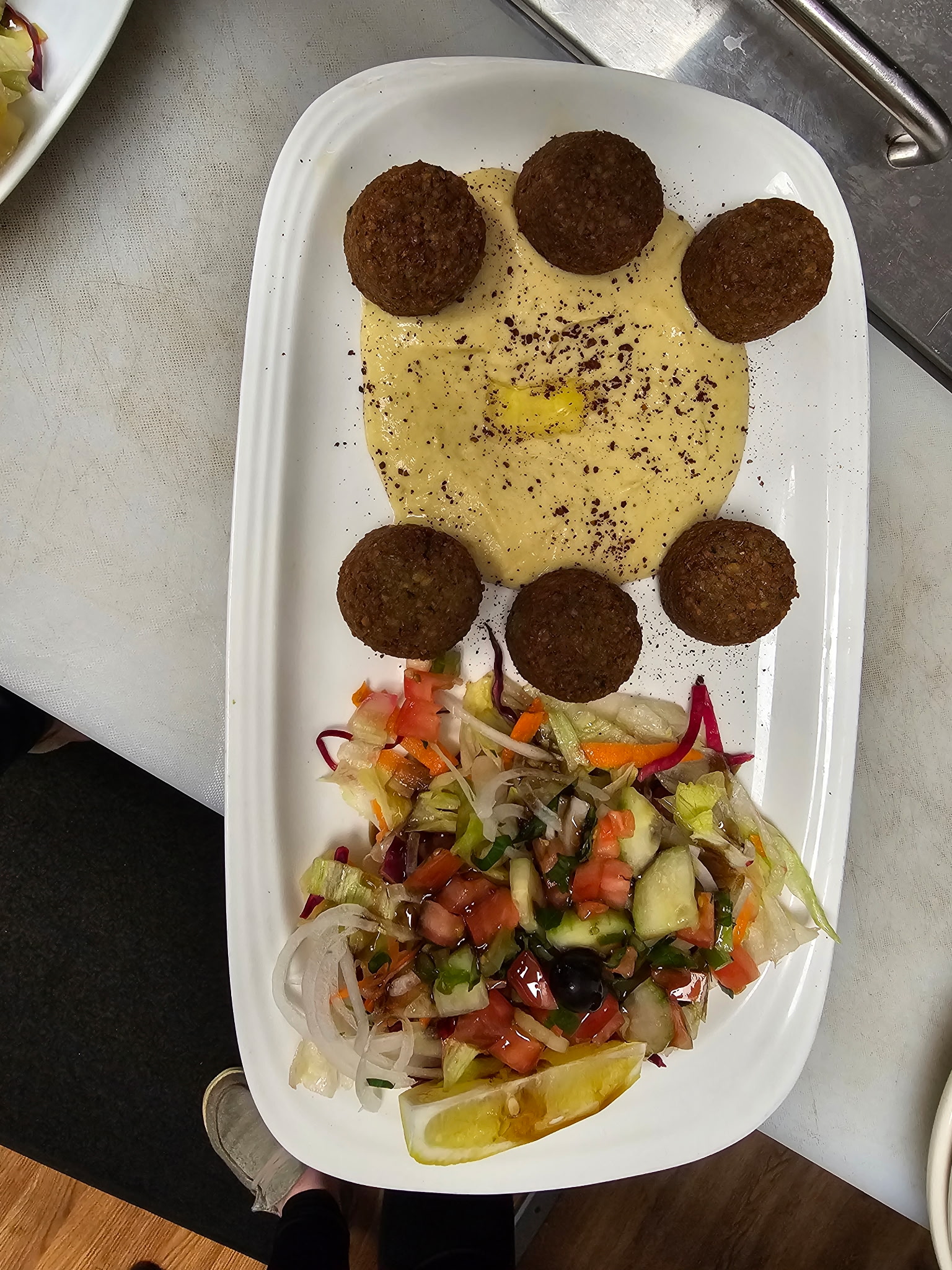 Falafel on hummus with house salad