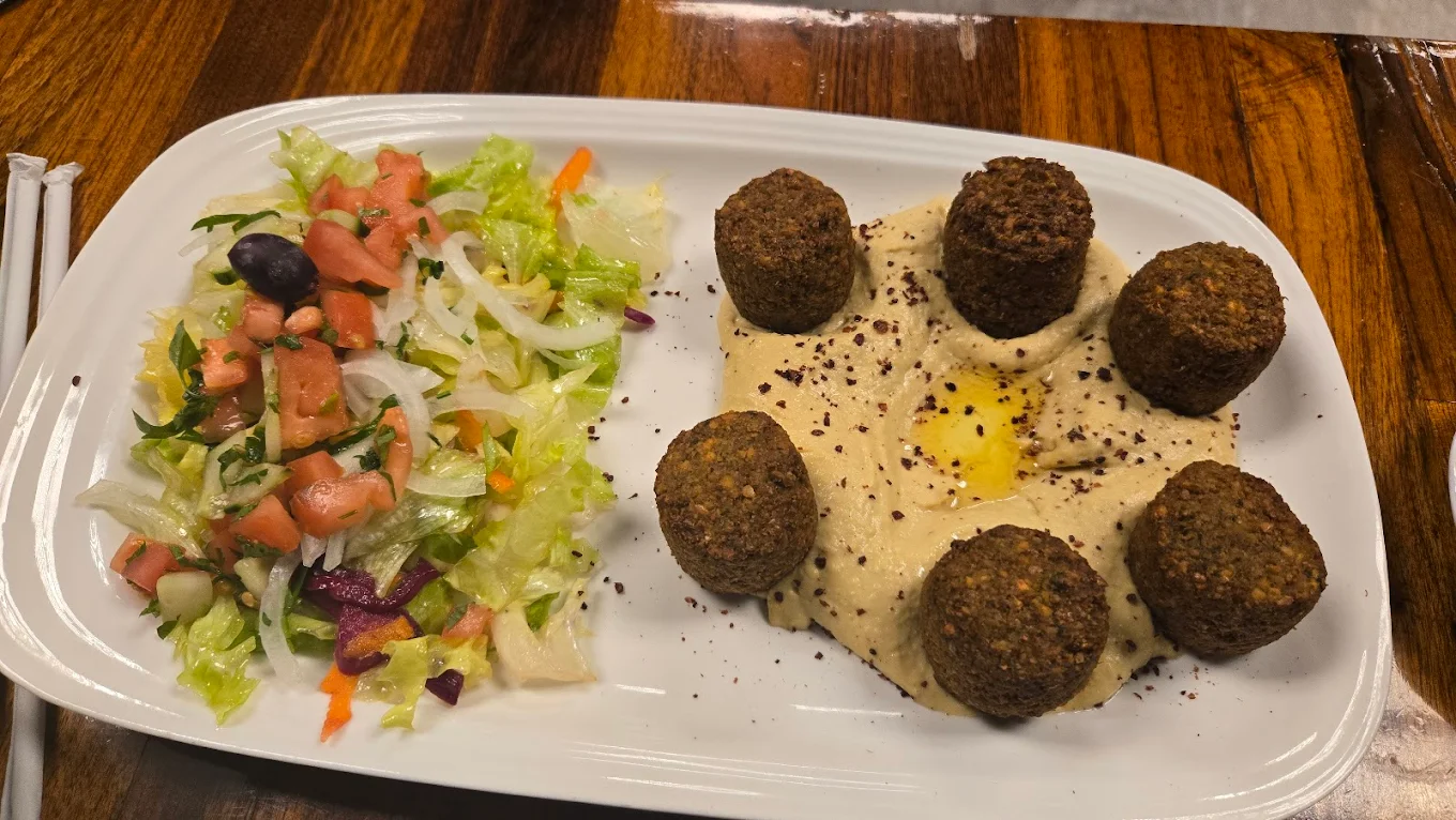 Falafel on hummus with house salad