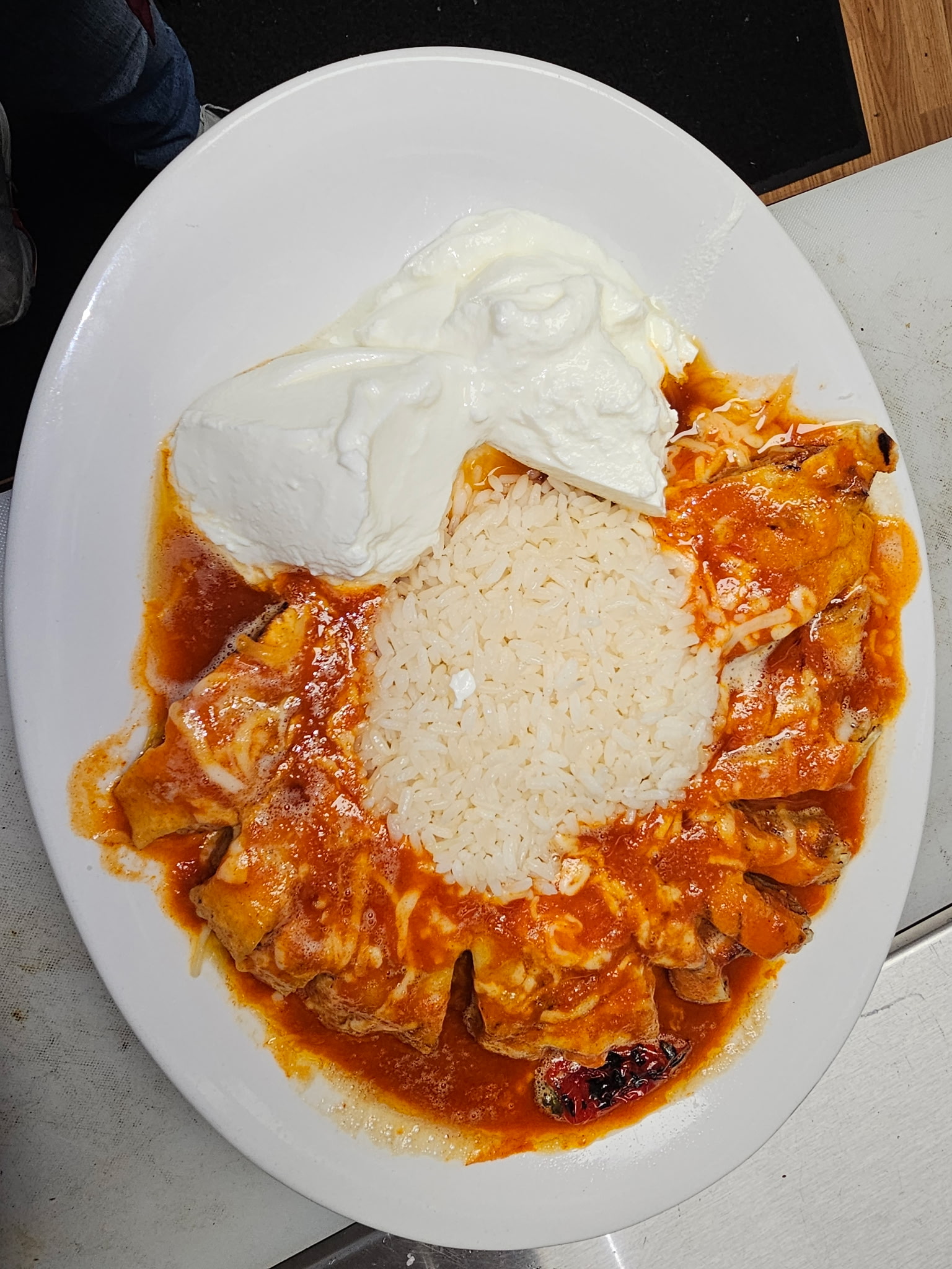Iskender kebab with tomato sauce and yogurt