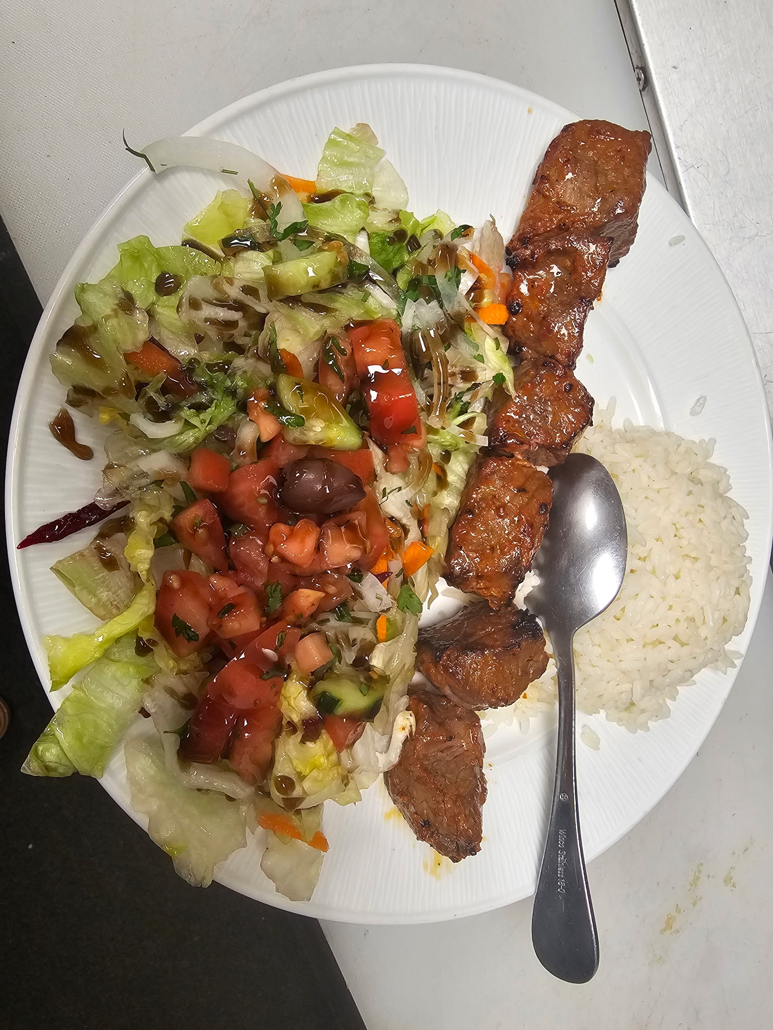 Lamb kebab with house salad and rice