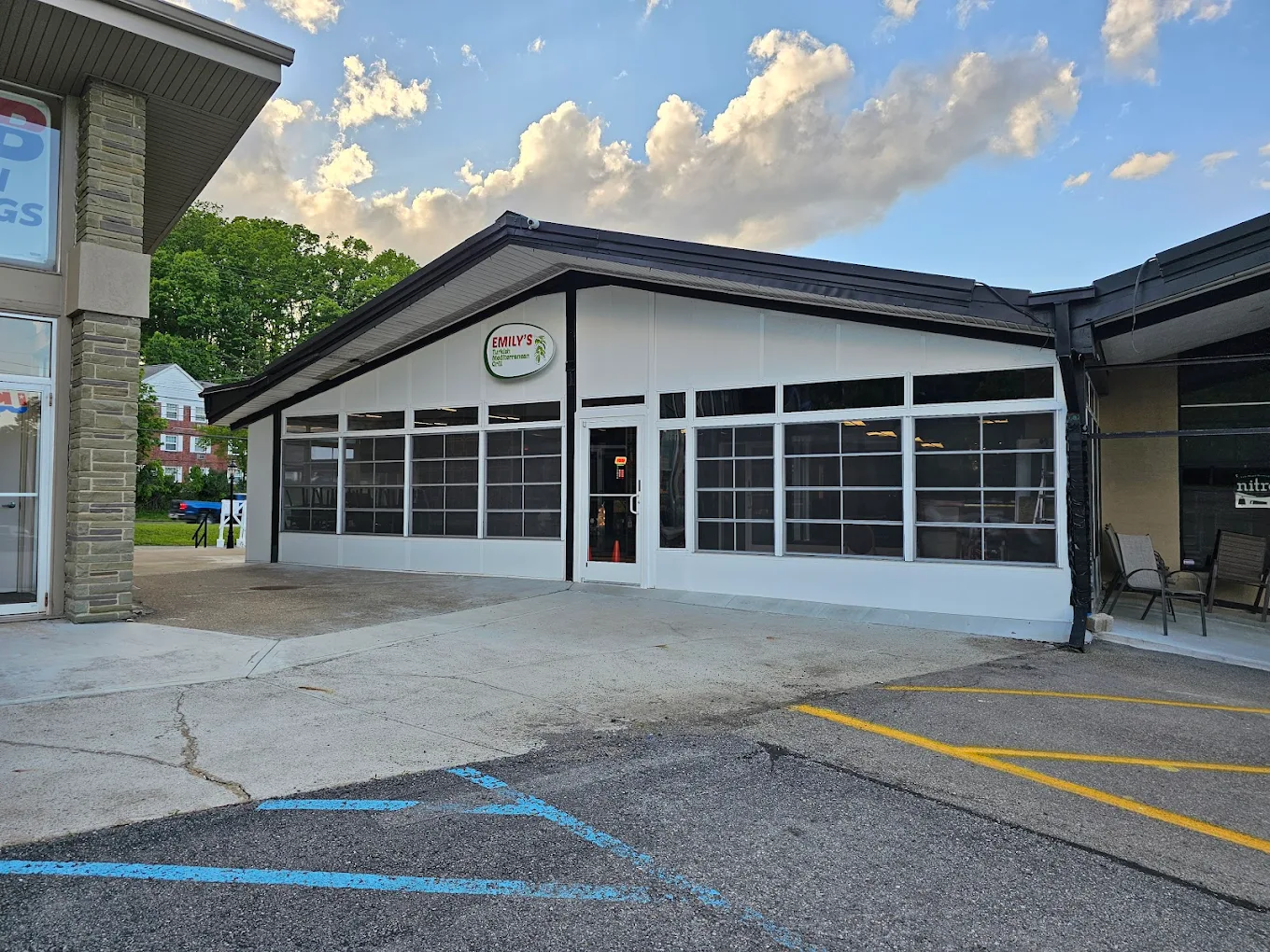 Emily's Bar and Grill storefront at dusk